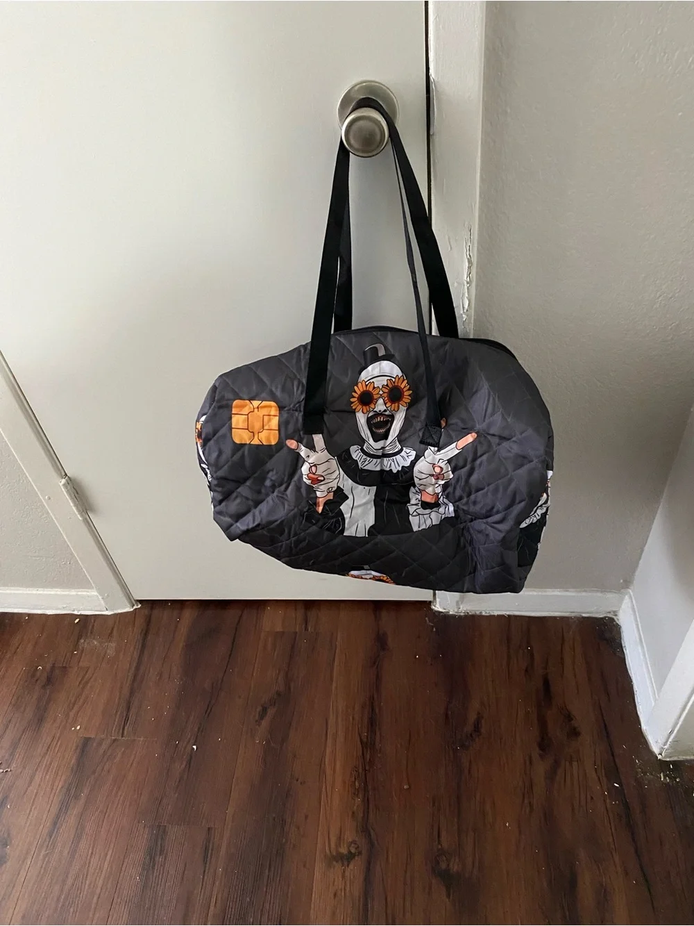 Art the clown Graphic Duffle Bag with Orange Accents